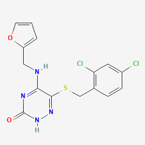 molecular formula C15H12Cl2N4O2S B7753856 6-((2,4-dichlorobenzyl)thio)-5-((furan-2-ylmethyl)amino)-1,2,4-triazin-3(2H)-one 