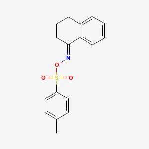 molecular formula C17H17NO3S B7788111 {[3,4-dihydro-1(2H)-naphthalenylidenamino]oxy}(4-methylphenyl)dioxo-lambda~6~-sulfane 