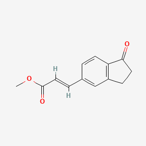 molecular formula C13H12O3 B7790040 methyl (2E)-3-(1-oxo-2,3-dihydro-1H-inden-5-yl)-2-propenoate 