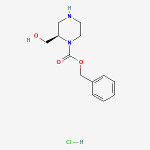 molecular formula C13H19ClN2O3 B7804670 Benzyl (R)-2-(hydroxymethyl)piperazine-1-carboxylate hydrochloride 