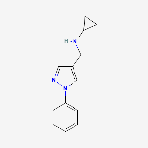 molecular formula C13H15N3 B7807100 N-[(1-Phenyl-1H-pyrazol-4-YL)methyl]cyclopropanamine 