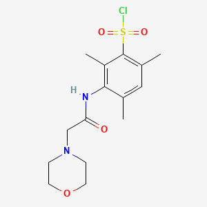 molecular formula C15H21ClN2O4S B7813079 2,4,6-Trimethyl-3-[(2-morpholin-4-ylacetyl)amino]benzenesulfonyl chloride 