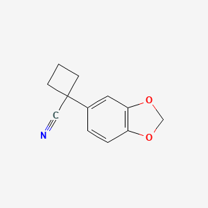 molecular formula C12H11NO2 B7815879 1-(1,3-Benzodioxol-5-yl)cyclobutanecarbonitrile 