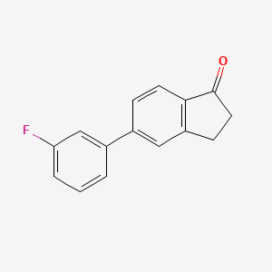 molecular formula C15H11FO B7838249 5-(3-Fluorophenyl)-2,3-dihydroinden-1-one 