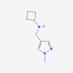 molecular formula C9H15N3 B7861255 N-[(1-methyl-1H-pyrazol-4-yl)methyl]cyclobutanamine 