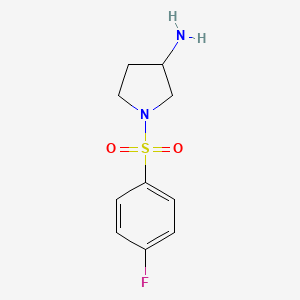 molecular formula C10H13FN2O2S B7869228 1-(4-Fluorophenyl)sulfonylpyrrolidin-3-amine 