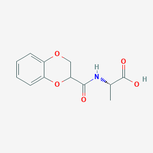 molecular formula C12H13NO5 B7869974 (2S)-2-[(2,3-dihydro-1,4-benzodioxin-2-ylcarbonyl)amino]propanoic acid 