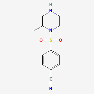 molecular formula C12H15N3O2S B7870457 4-((2-Methylpiperazin-1-yl)sulfonyl)benzonitrile 