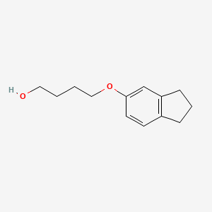 molecular formula C13H18O2 B7876751 4-(2,3-dihydro-1H-inden-5-yloxy)butan-1-ol 