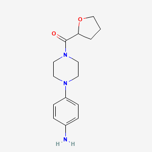 molecular formula C15H21N3O2 B7877830 4-(4-Tetrahydro-2-furanoyl-1-piperazinyl)aniline 