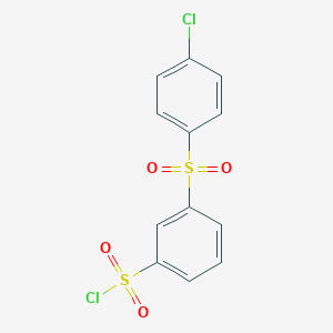 molecular formula C12H8Cl2O4S2 B7878821 3-[(4-Chlorophenyl)sulfonyl]benzenesulfonyl chloride 