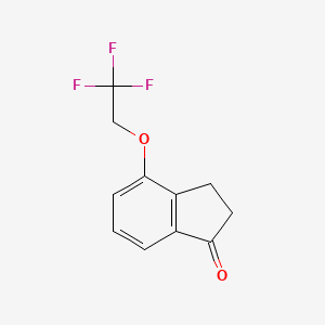 molecular formula C11H9F3O2 B7879270 4-(2,2,2-Trifluoroethoxy)-2,3-dihydro-1H-inden-1-one 