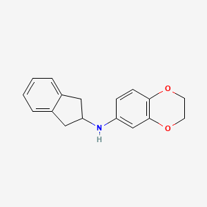 molecular formula C17H17NO2 B7879338 N-2,3-Dihydrobenzo[1,4]dioxin-6-yl-N-indan-2-ylamine 