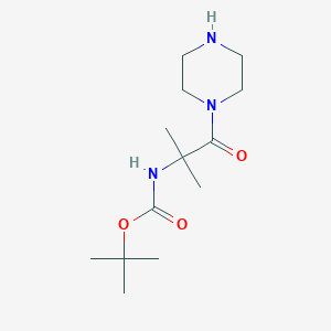 molecular formula C13H25N3O3 B7882139 tert-butyl N-[2-methyl-1-oxo-1-(piperazin-1-yl)propan-2-yl]carbamate 