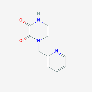 molecular formula C10H11N3O2 B7883124 1-(Pyridin-2-ylmethyl)piperazine-2,3-dione 