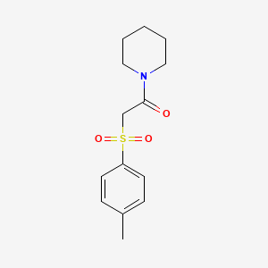 2-(4-Methylphenyl)sulfonyl-1-piperidin-1-ylethanone