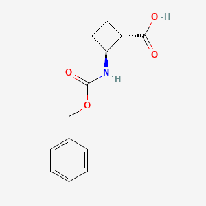 molecular formula C13H15NO4 B7889563 (1S,2S)-2-{[(benzyloxy)carbonyl]amino}cyclobutane-1-carboxylic acid 