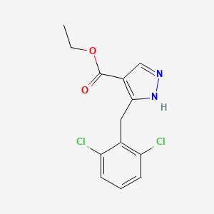ethyl 5-[(2,6-dichlorophenyl)methyl]-1H-pyrazole-4-carboxylate