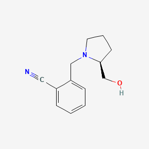 molecular formula C13H16N2O B7892506 2-{[(2S)-2-(Hydroxymethyl)pyrrolidin-1-yl]methyl}benzonitrile 