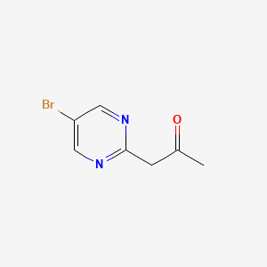 molecular formula C7H7BrN2O B7893971 1-(5-Bromopyrimidin-2-yl)propan-2-one 