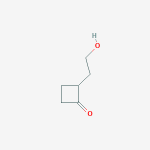 molecular formula C6H10O2 B7900309 2-(2-Hydroxyethyl)cyclobutanone 