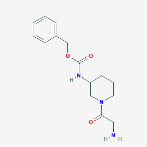 molecular formula C15H21N3O3 B7917130 [1-(2-Amino-acetyl)-piperidin-3-yl]-carbamic acid benzyl ester 