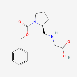 molecular formula C15H20N2O4 B7923206 (S)-2-[(Carboxymethyl-amino)-methyl]-pyrrolidine-1-carboxylic acid benzyl ester 