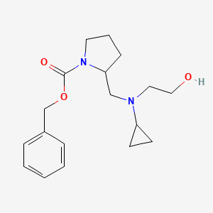 molecular formula C18H26N2O3 B7924787 2-{[Cyclopropyl-(2-hydroxy-ethyl)-amino]-methyl}-pyrrolidine-1-carboxylic acid benzyl ester 