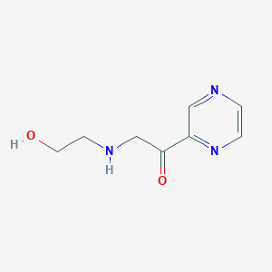 molecular formula C8H11N3O2 B7926010 2-(2-Hydroxy-ethylamino)-1-pyrazin-2-yl-ethanone 