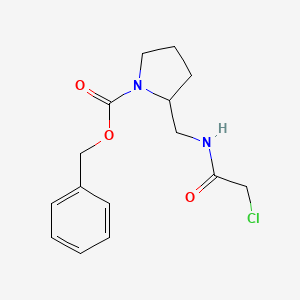 molecular formula C15H19ClN2O3 B7929354 2-[(2-Chloro-acetylamino)-methyl]-pyrrolidine-1-carboxylic acid benzyl ester 