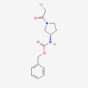 molecular formula C14H17ClN2O3 B7930960 [(S)-1-(2-Chloro-acetyl)-pyrrolidin-3-yl]-carbamic acid benzyl ester 