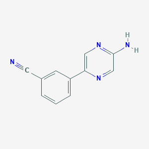 molecular formula C11H8N4 B7940895 3-(5-Aminopyrazin-2-yl)benzonitrile 