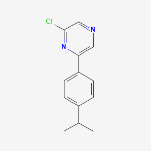 molecular formula C13H13ClN2 B7941063 2-Chloro-6-(4-isopropylphenyl)pyrazine 