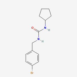 molecular formula C13H17BrN2O B7942509 1-[(4-Bromophenyl)methyl]-3-cyclopentylurea 