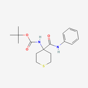 molecular formula C17H24N2O3S B7943780 tert-butyl N-[4-(phenylcarbamoyl)thian-4-yl]carbamate 