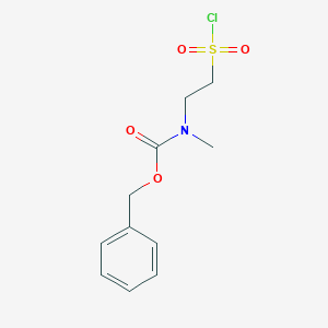 molecular formula C11H14ClNO4S B7961753 Benzyl N-[2-(chlorosulfonyl)ethyl]-N-methylcarbamate 
