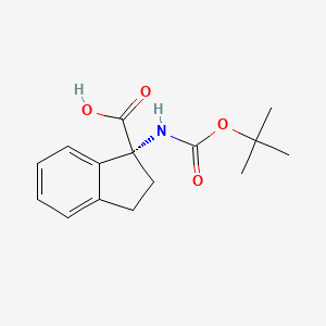 molecular formula C15H19NO4 B7969797 rel-(1R)-1-{[(tert-butoxy)carbonyl]amino}-2,3-dihydro-1H-indene-1-carboxylic acid 