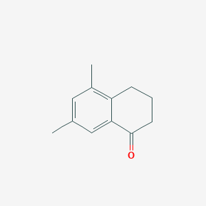 molecular formula C12H14O B079758 5,7-二甲基-1-茚满酮 CAS No. 13621-25-5