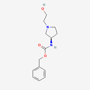 molecular formula C14H20N2O3 B7984994 [(R)-1-(2-Hydroxy-ethyl)-pyrrolidin-3-yl]-carbamic acid benzyl ester 