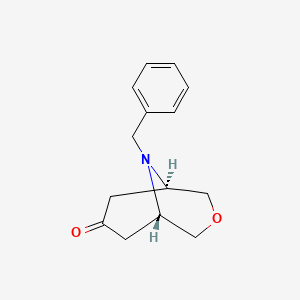 molecular formula C14H17NO2 B7987686 (1S,5R)-9-benzyl-3-oxa-9-azabicyclo[3.3.1]nonan-7-one 