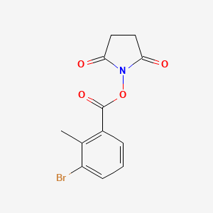 molecular formula C12H10BrNO4 B8006994 2,5-Dioxopyrrolidin-1-yl 3-bromo-2-methylbenzoate 