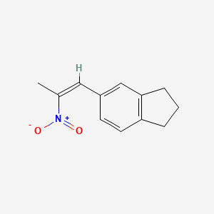 molecular formula C12H13NO2 B8008295 5-[(1Z)-2-nitroprop-1-en-1-yl]-2,3-dihydro-1H-indene 
