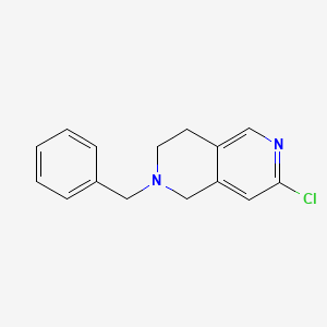 molecular formula C15H15ClN2 B8011443 2-Benzyl-7-chloro-1,2,3,4-tetrahydro-[2,6]naphthyridine 