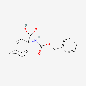 molecular formula C19H23NO4 B8014393 2-(Benzyloxycarbonylamino)-2-adamantanecarboxylic acid 
