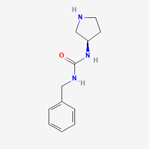 molecular formula C12H17N3O B8015382 1-Benzyl-3-[(3R)-pyrrolidin-3-yl]urea 