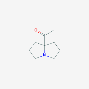 molecular formula C9H15NO B8021258 1-(Hexahydro-1H-pyrrolizin-7a-yl)ethanone 