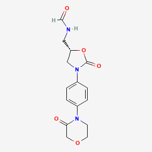 molecular formula C15H17N3O5 B8024129 N-({(5S)-2-oxo-3-[4-(3-oxomorpholin-4-yl)phenyl]-1,3-oxazolidin-5-yl}methyl)formamide 