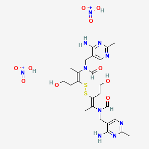 molecular formula C24H36N10O10S2 B8024647 N-[(4-amino-2-methylpyrimidin-5-yl)methyl]-N-[(Z)-3-[[(E)-2-[(4-amino-2-methylpyrimidin-5-yl)methyl-formylamino]-5-hydroxypent-2-en-3-yl]disulfanyl]-5-hydroxypent-2-en-2-yl]formamide;nitric acid 