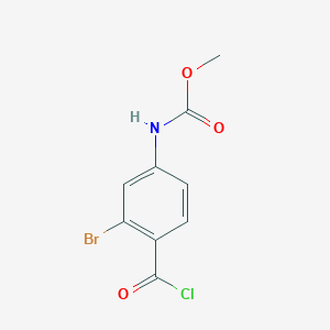 molecular formula C9H7BrClNO3 B8026469 Methyl (3-bromo-4-(chlorocarbonyl)phenyl)carbamate 