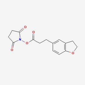 molecular formula C15H15NO5 B8034865 1-{[3-(2,3-Dihydro-1-benzofuran-5-yl)propanoyl]oxy}pyrrolidine-2,5-dione 